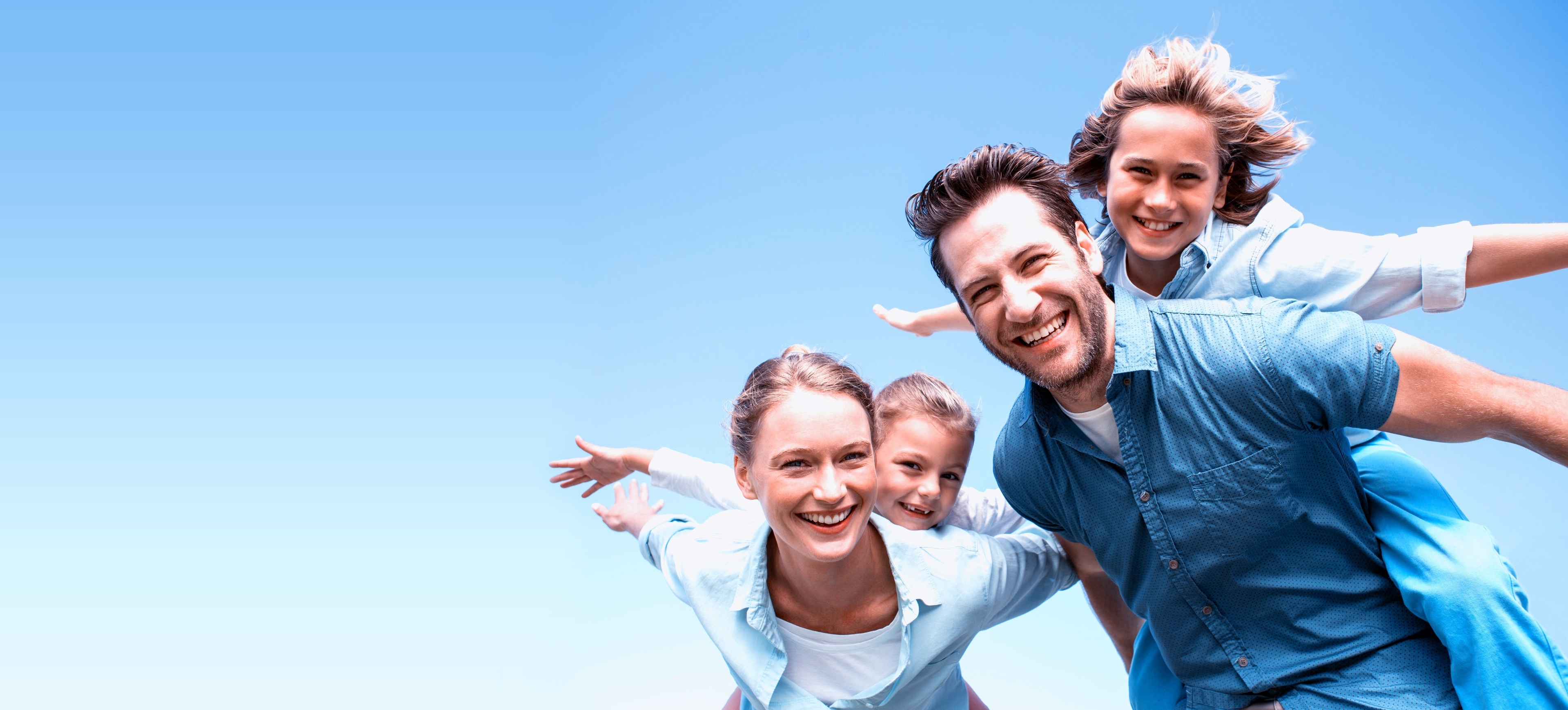 Happy family with arms spread enjoying life
